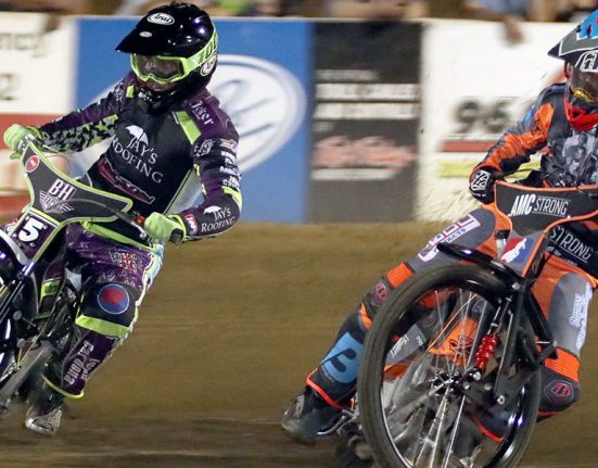 2 speedway racers mid turn