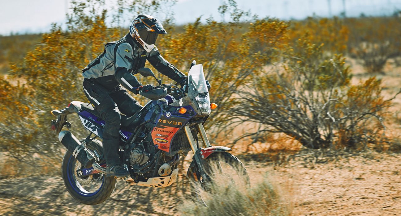 Off -road rider driving through desert.