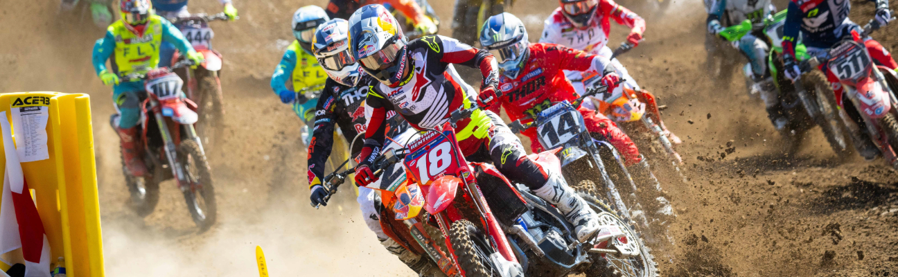 Motorcyclists racing on dirt path