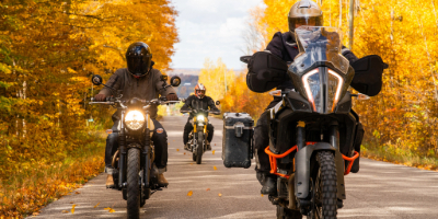 Motorcycles driving on road in the fall