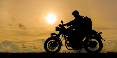 motorcycle riding in the sunset